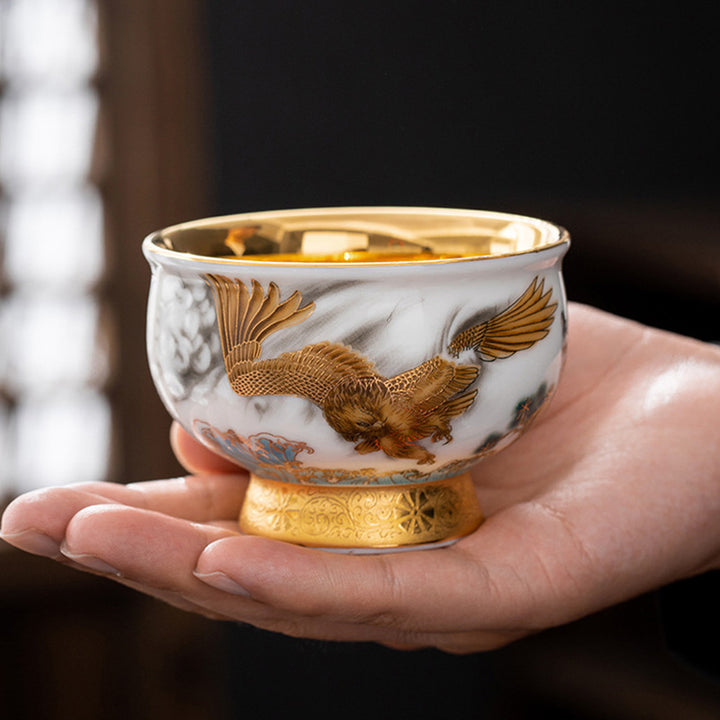 Buddha Stones Golden Eagle Auspicious Dragon Sun Ocean Waves Gilt Ceramic Teacup Kung Fu Tea Cup - Golden Eagle 8.6cm*6.1cm*180ml - image 0