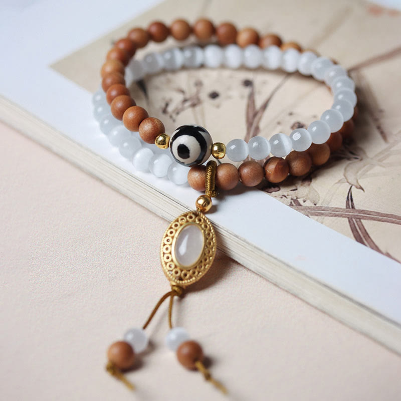 Buddha Stones Sandalwood Cat's Eye Three-eyed Dzi Bead Crystal Protectioin Bracelet - image 1
