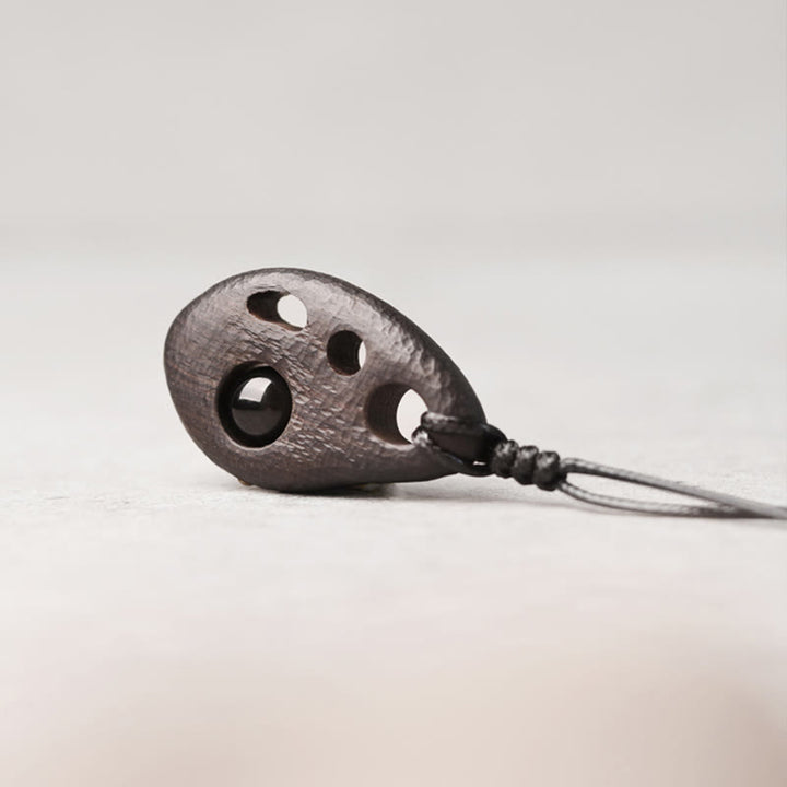 Buddha Stones Ebony Wood Hollow Inlaid Obsidian Peace Calm Necklace Pendant - image 1