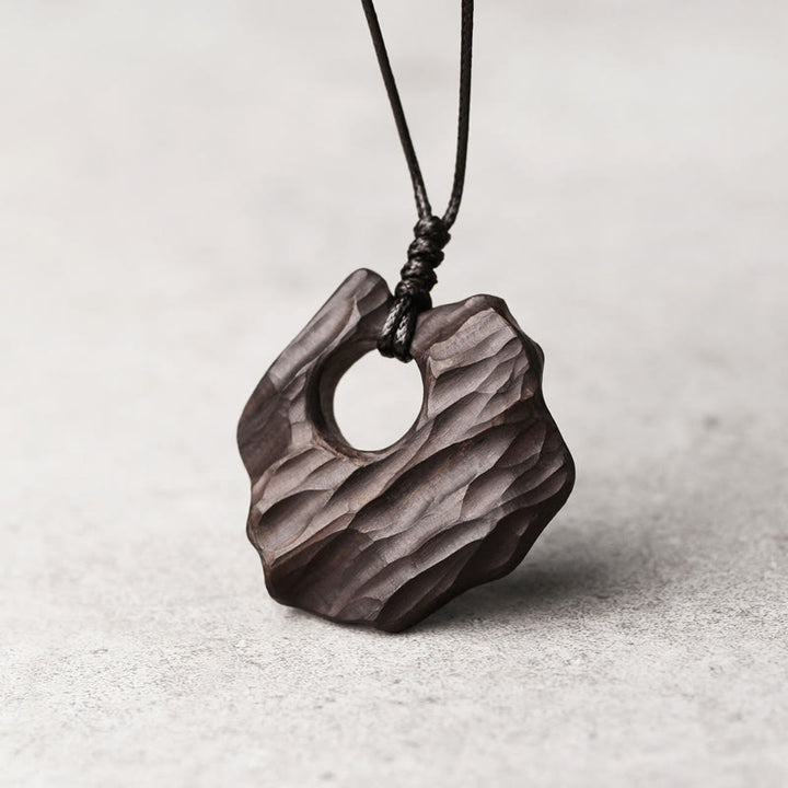 Buddha Stones Ebony Wood Hollow Irregular Shape Peace Balance Necklace Pendant - image 1