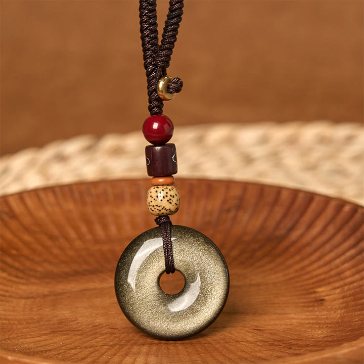 Buddha Stones Natural Gold Sheen Obsidian Peace Buckle Strengthen Key Chain - image 1