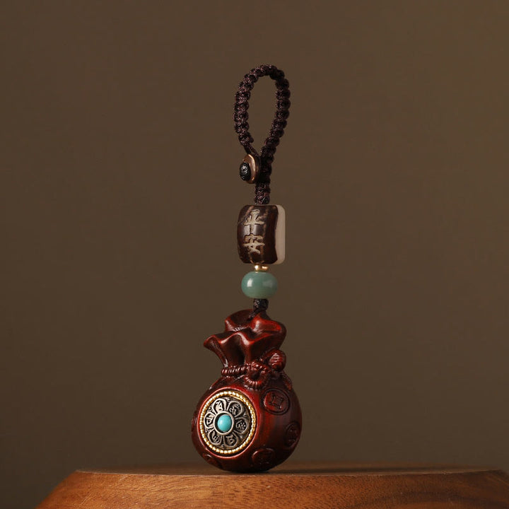 Buddha Stones Small Leaf Red Sandalwood Green Sandalwood Money Bag Om Mani Padme Hum Rotatable Protection Hanging Decoration - Small Leaf Red Sandalwood(Keep away evil spirits♥Protection) - Key Chain - image 0