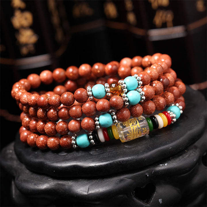 Buddha Stones 108 Mala Beads Goldstone Om Mani Padme Hum Swastika Confidence Bracelet - image 1