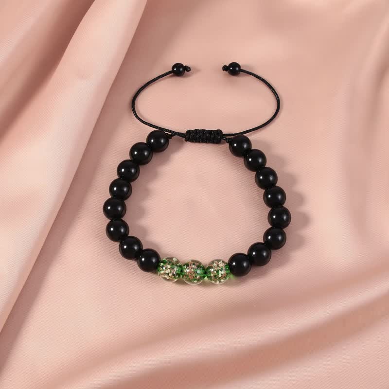 Buddha Stones Black Obsidian Luminous Glowstone Strength Bracelet - Green - image 0